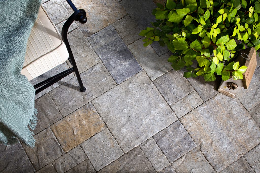 slate patio pavers with outdoor chair and plant