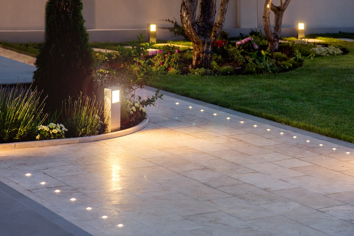 a stone pathway with integrated lighting fixtures