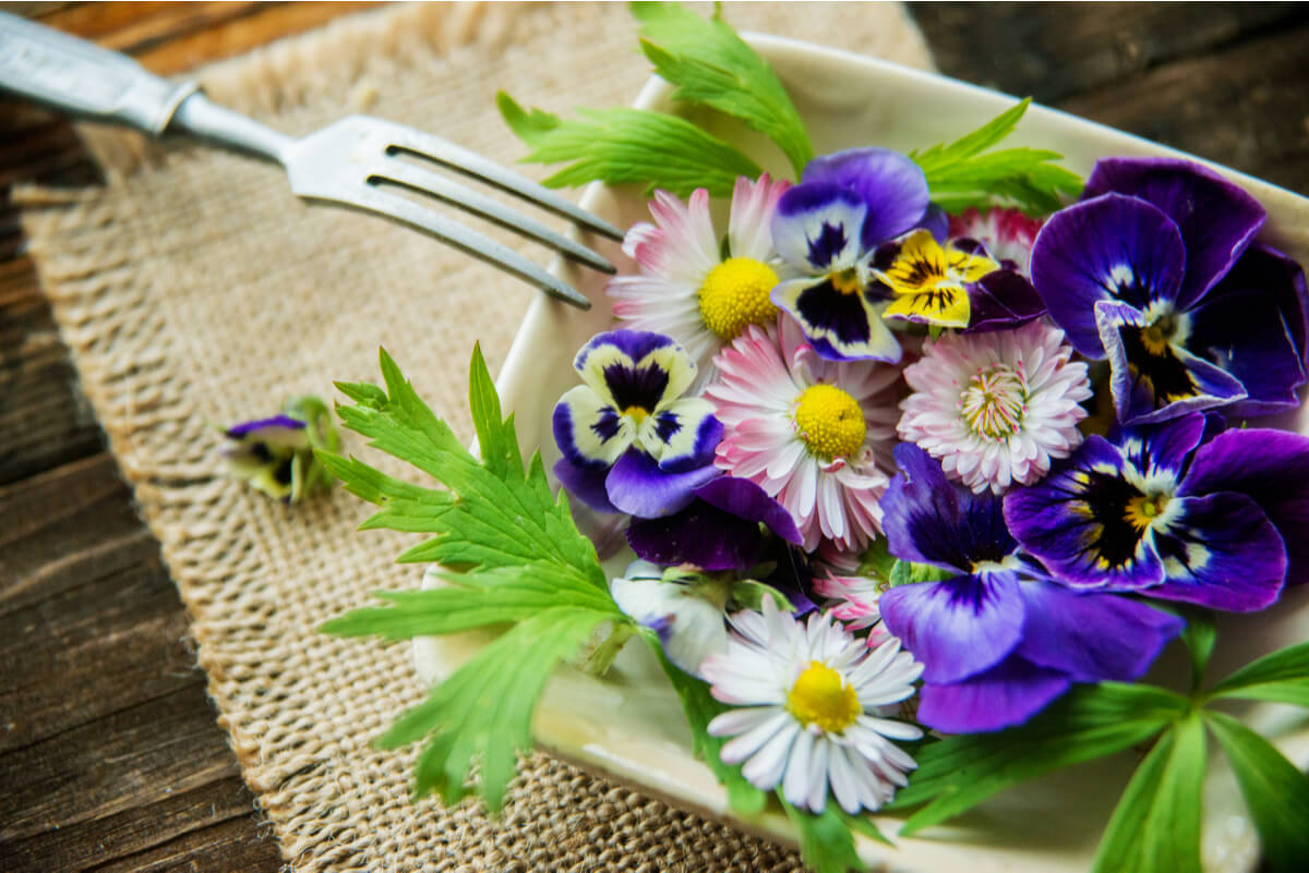 A bowl of colorful edible flowers